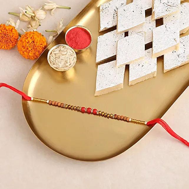 Red Beads Designer Rakhi & Kaju Katli