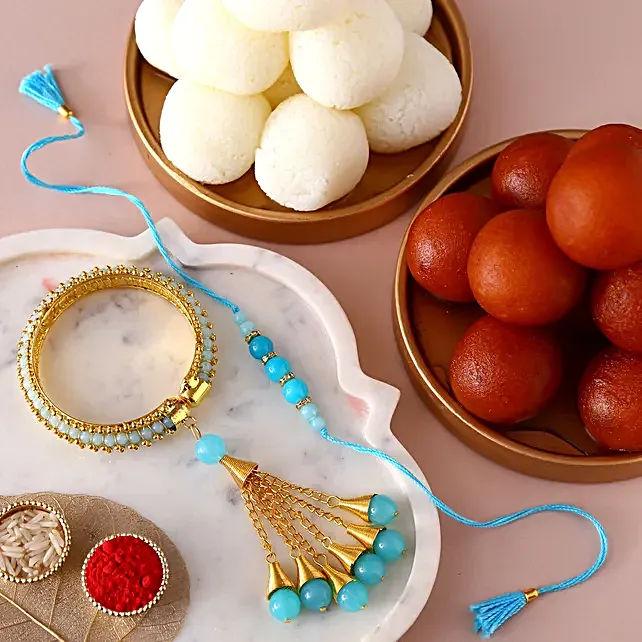 Blue Rakhi Set & Sweets Tin